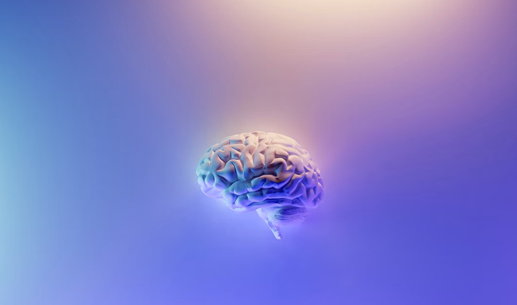 Glowing image of a human brain with purple background