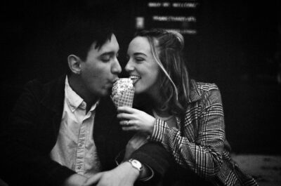 Couple sharing an ice cream cone with each other