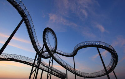 Silhouette of a roller coaster at sunset